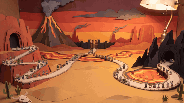 The Ember Wastes set moving: two columns of tiny paper soldiers march along a switchback road between a cave in a red cliff and a black crag, over lava bridges, while the volcano smokes behind them