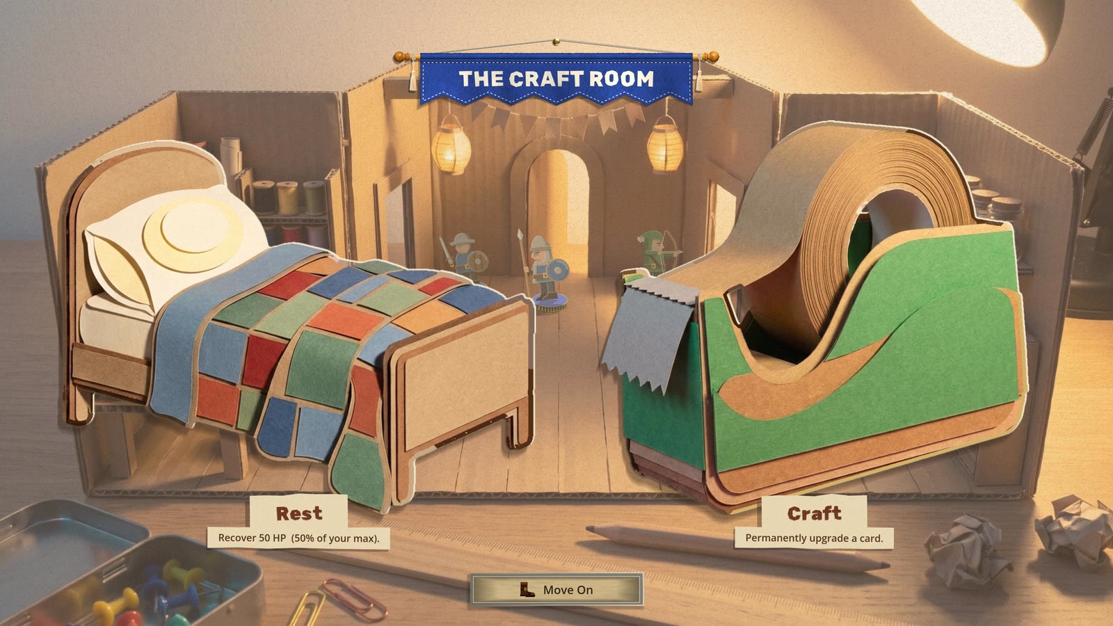 The Craft Room: a cardboard workshop under a desk lamp, a paper bed with a patchwork quilt labelled Rest and a giant green tape dispenser labelled Craft, with small paper soldiers walking past the doorways at the back