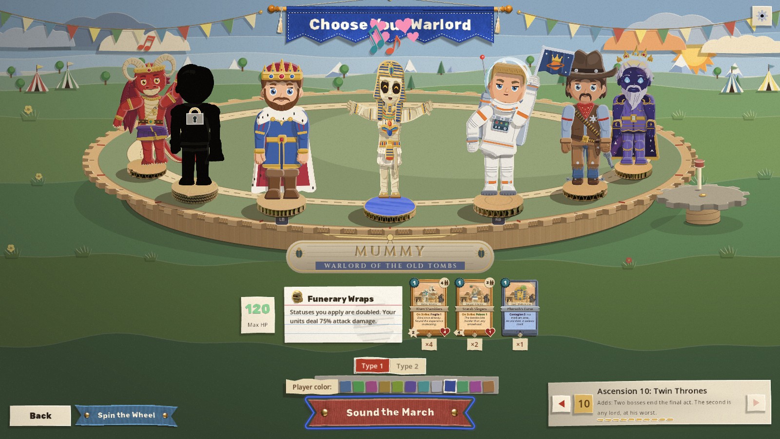 The warlord wheel is a corrugated cardboard platter cut as a cog, with a grey chipboard pinion and crank meshing at its right edge, standing in a paper country of hills, tents and bunting; the Mummy stands at the front with his relic on a ruled index card
