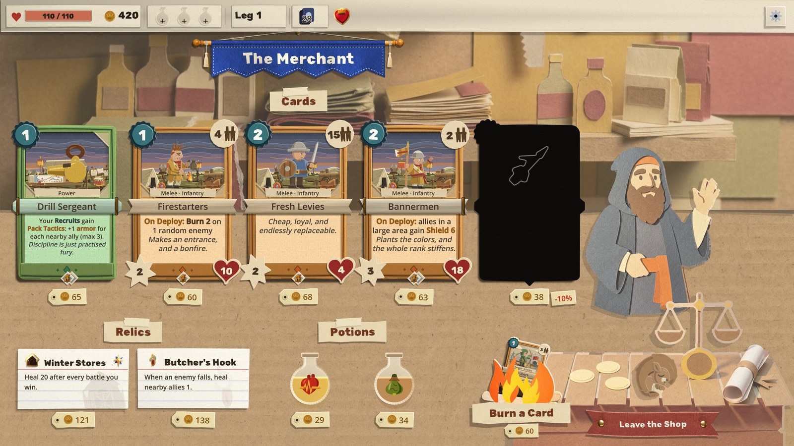 The rebuilt shop: the Merchant's blue banner over the stall, a Cards slip taped above four cards and a fifth lying face down, Relics and Potions slips over two relics on index cards and two flasks, the craft-stick fire under Burn a Card with a card going in, the squirrel asleep on the counter, and Leave the Shop on a red ribbon pinned to the counter's front