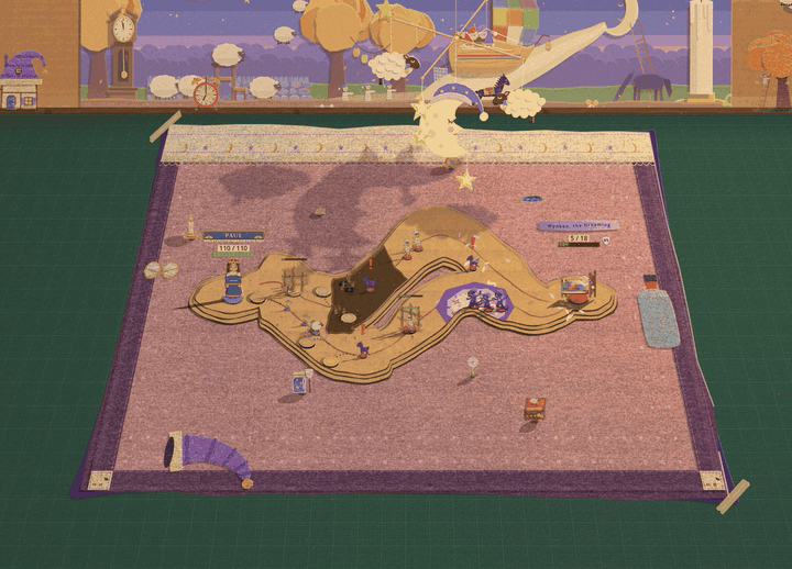 A pink felt blanket with a cardboard road on a green cutting mat, under a paper backdrop of a night sky with a moon and sheep. A crib mobile hangs over the far edge of the blanket and its pieces turn to show their dark backs. A purple-black cut paper shadow spreads out from under the blanket on all three sides, curling finger shapes reach out across the mat, and pairs of yellow eyes open in the shadow