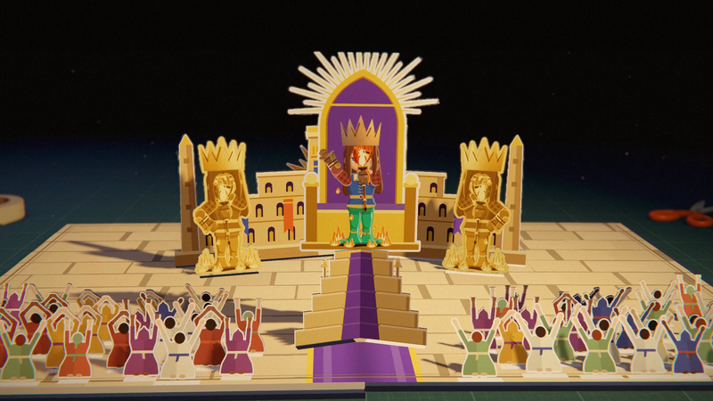 A gold pop-up throne on a stepped temple, with the warlord crowned on it, two gold guards beside it, and a crowd of paper people kneeling below