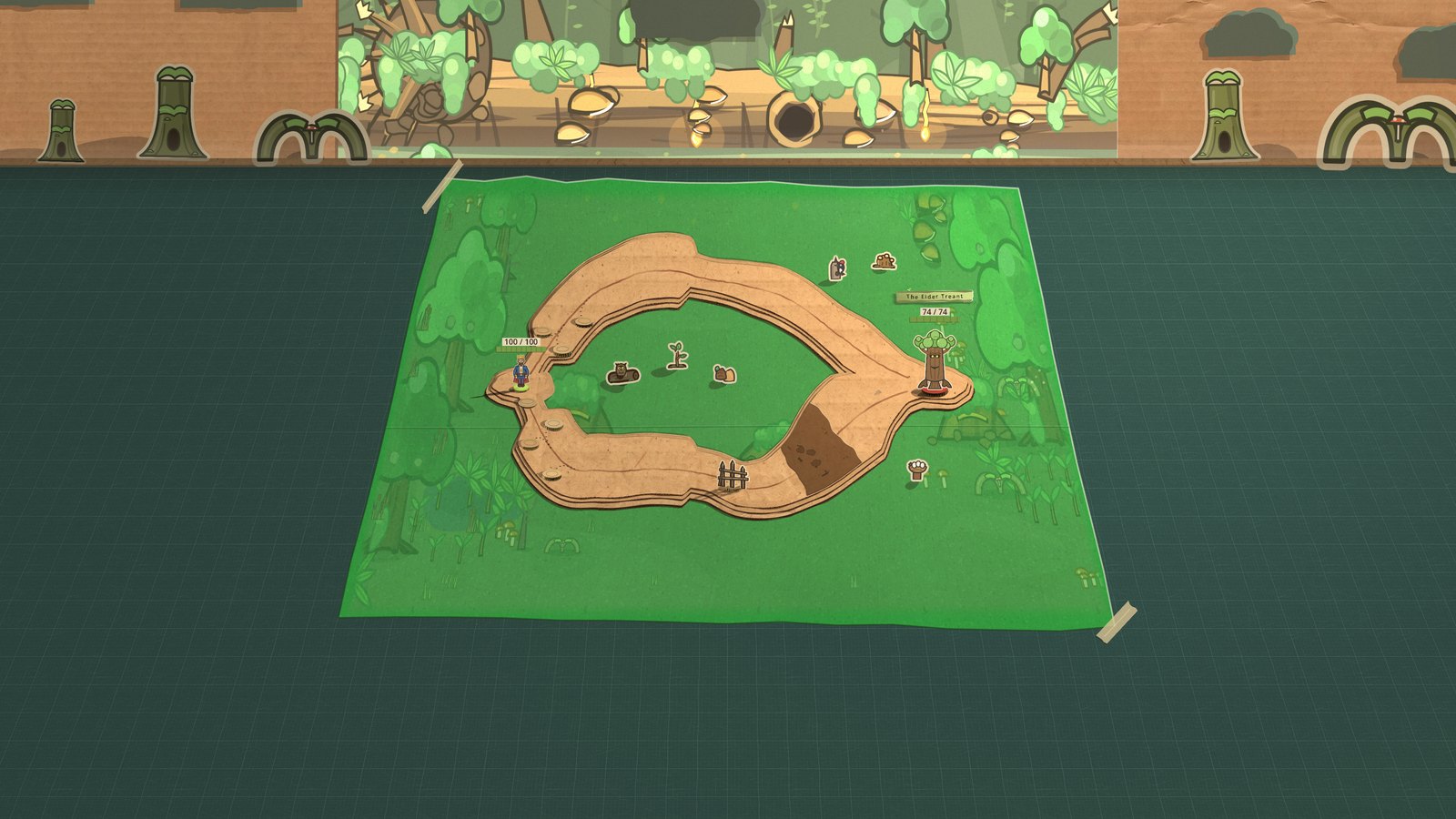 The whole box from the front: the Elder Treant's Rootheart taped to the kraft back wall, die-cut stumps and root arches standing along the seam, and the green mat taped down to the cutting-mat desk with the lanes cut into it